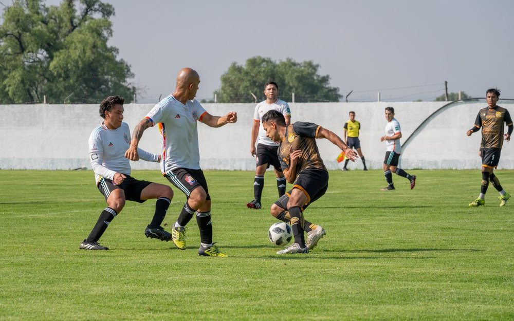 A football match with a LIVE badge and a score bar added to the photo, as an example of how your stream can look.